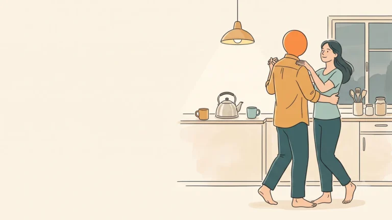 A couple slow dancing barefoot in the kitchen in the evening
