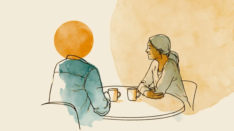 how cycle awareness changes a relationship: a couple talking across a table over two mugs
