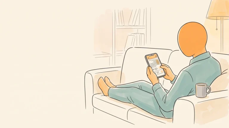 A man relaxing on a couch in the evening holding a phone showing a calendar app