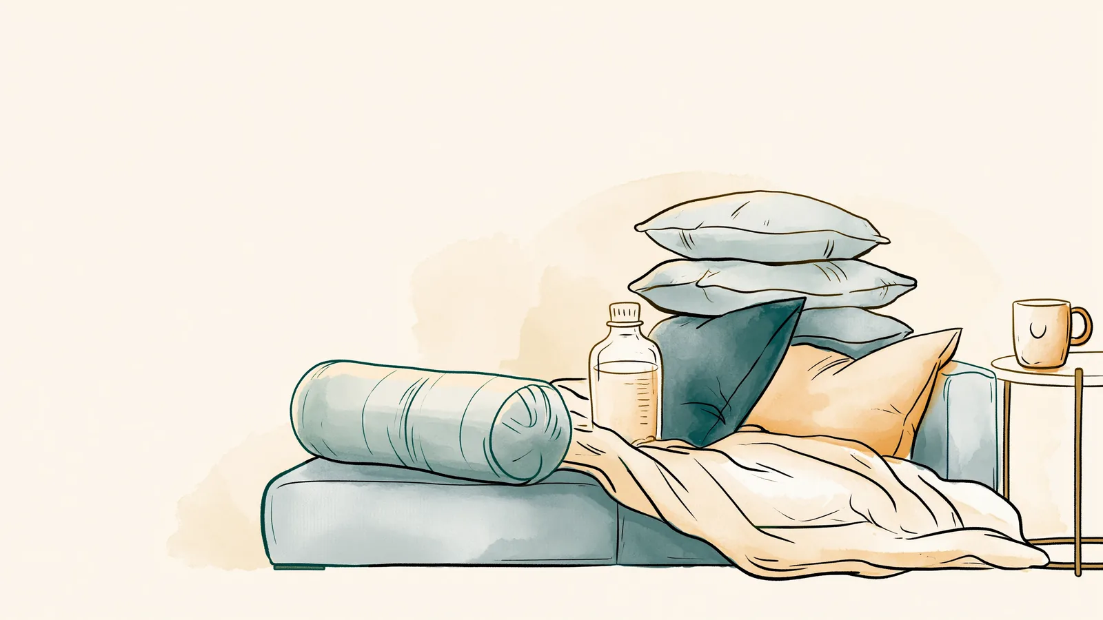 A couch set up for rest with pillows, a bolster, a blanket, a heating pad and a mug for period cramps