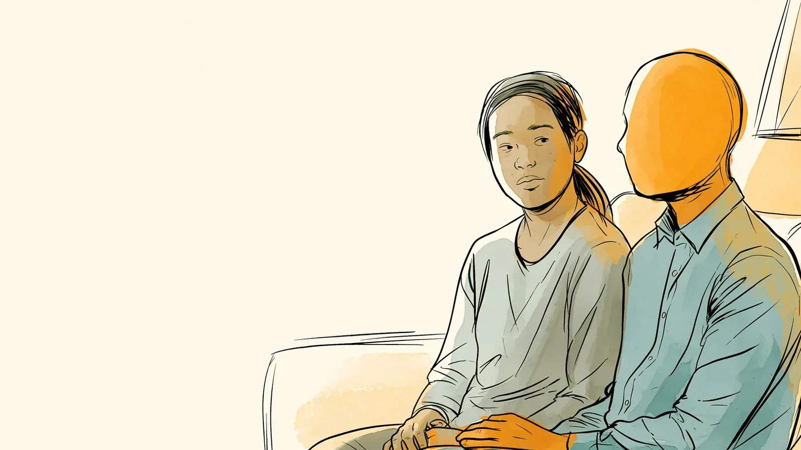 Couple talking quietly on the couch about a yeast infection before her period