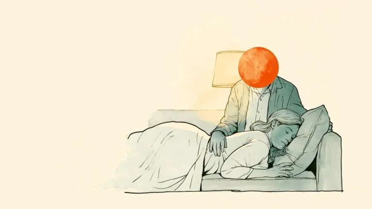 Partner resting a hand on her back while she lies on the couch, gentle physical touch during period